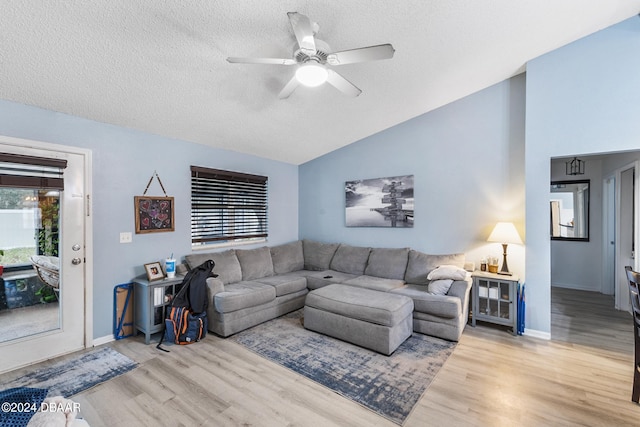 10 Pine Brook Dr, Palm Coast, FL 32164 - living room with a textured ceiling, light hardwood / wood-style flooring, lofted ceiling, and ceiling fan