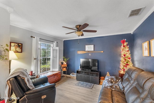 10 Pine Brook Dr, Palm Coast, FL 32164 - living room featuring light wood-type flooring, a textured ceiling, ceiling fan, and crown molding