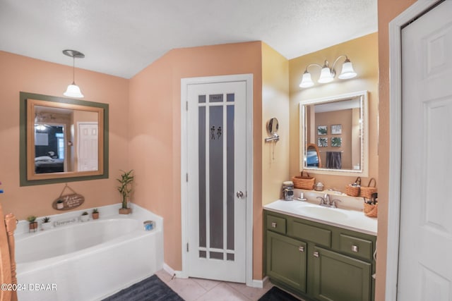 10 Pine Brook Dr, Palm Coast, FL 32164 - bathroom with a bathing tub, vanity, a textured ceiling, and tile patterned floors