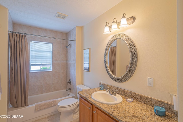 3756 S Atlantic Ave Unit 101, Daytona Beach, FL 32118 - bathroom with tile patterned floors, shower / bath combo with shower curtain, toilet, vanity, and visible vents