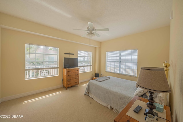 3756 S Atlantic Ave Unit 101, Daytona Beach, FL 32118 - carpeted bedroom featuring ceiling fan and baseboards