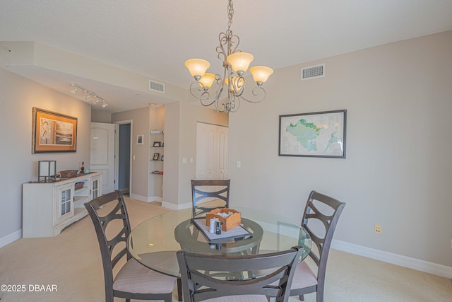 3756 S Atlantic Ave Unit 101, Daytona Beach, FL 32118 - dining room with visible vents, an inviting chandelier, and light colored carpet