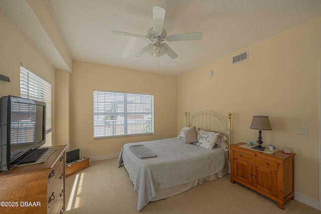 3756 S Atlantic Ave Unit 101, Daytona Beach, FL 32118 - bedroom with visible vents, light carpet, and multiple windows