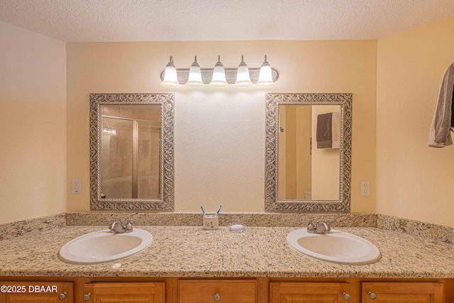 3756 S Atlantic Ave Unit 101, Daytona Beach, FL 32118 - bathroom featuring double vanity, an enclosed shower, and a sink
