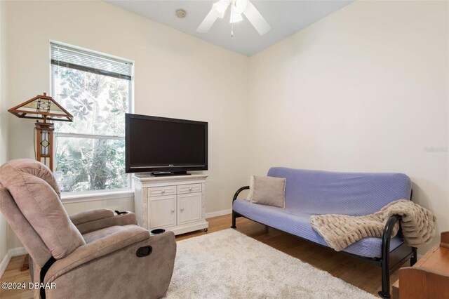 interior space featuring a wealth of natural light, wood-type flooring, and ceiling fan