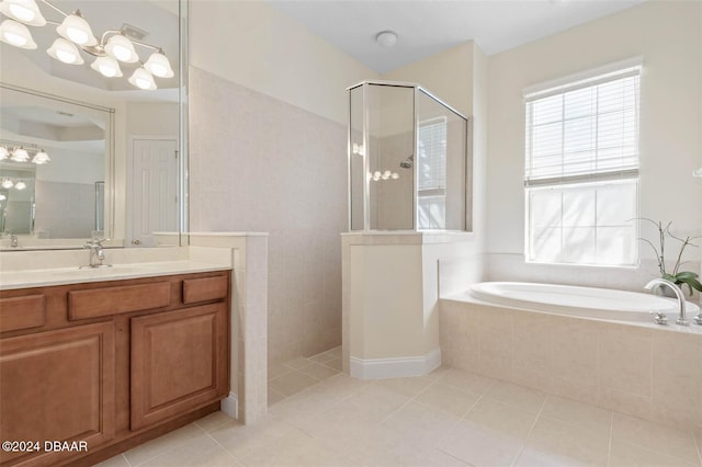 bathroom with independent shower and bath, vanity, and tile patterned flooring