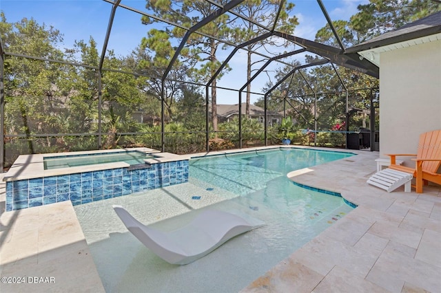 view of swimming pool featuring a lanai, an in ground hot tub, and a patio area