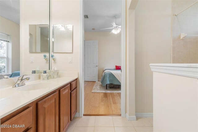 bathroom with vanity, ceiling fan, and tile patterned floors