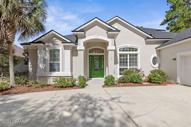 view of front of property with a garage