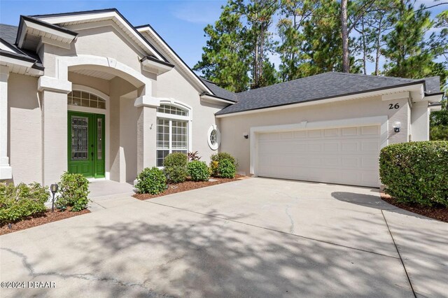 view of front of property with a garage