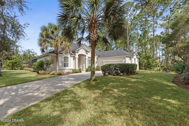 view of front of house featuring a garage and a front yard