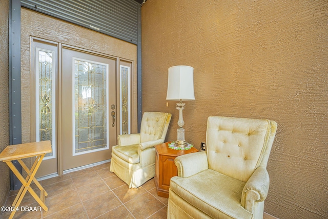 sitting room with tile patterned flooring