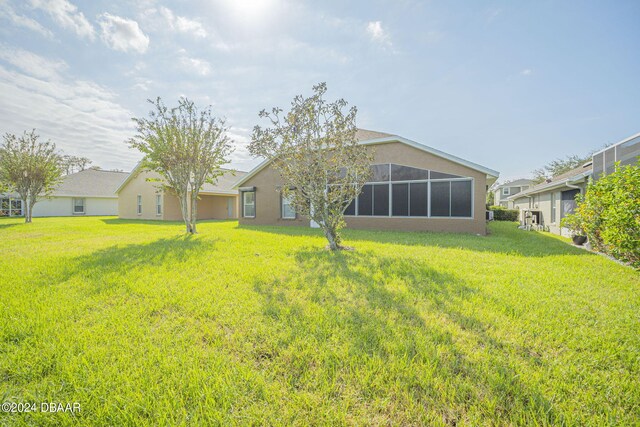 view of yard with a sunroom