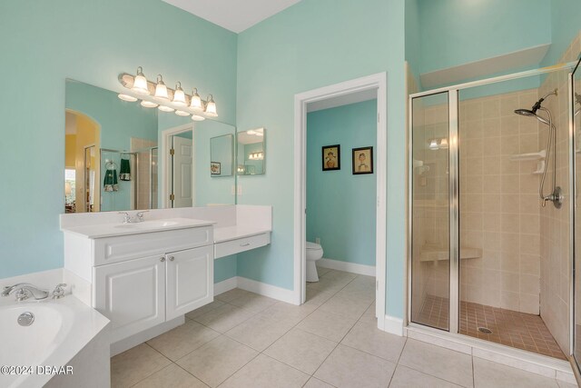 full bathroom with tile patterned flooring, shower with separate bathtub, and toilet