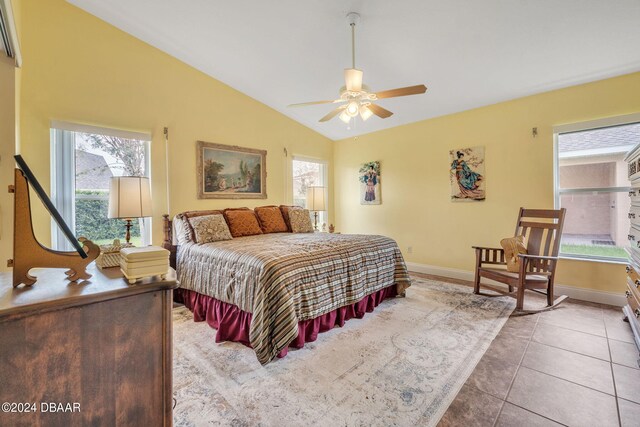 tiled bedroom featuring ceiling fan and vaulted ceiling