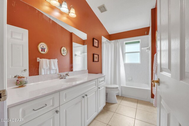 full bathroom with lofted ceiling, shower / bath combo with shower curtain, toilet, tile patterned flooring, and vanity