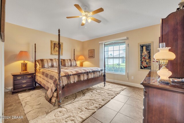 bedroom featuring ceiling fan and light tile patterned floors