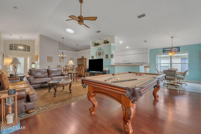 rec room featuring dark hardwood / wood-style flooring, a healthy amount of sunlight, and vaulted ceiling