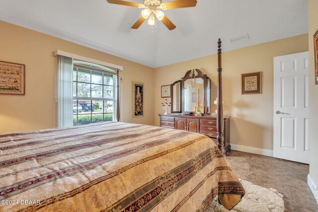 tiled bedroom with ceiling fan