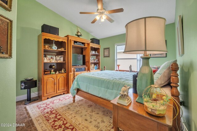 bedroom featuring ceiling fan and vaulted ceiling