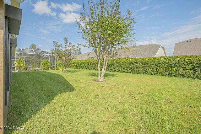 view of yard featuring a lanai