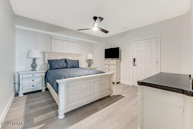 350 N Atlantic Ave Unit 2124, Daytona Beach, FL 32118 - bedroom with light hardwood / wood-style floors and ceiling fan