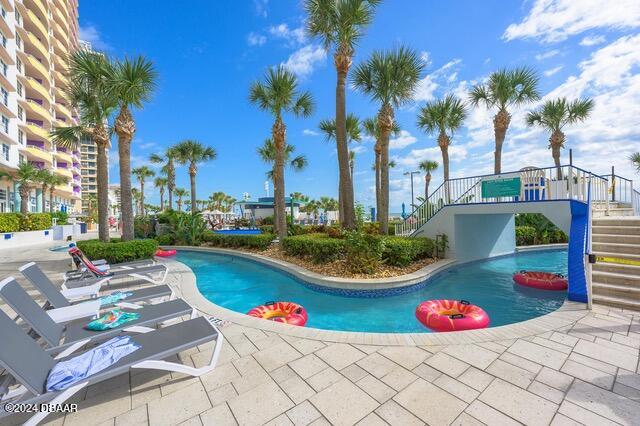 350 N Atlantic Ave Unit 2124, Daytona Beach, FL 32118 - view of pool with a patio