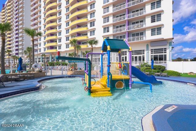 350 N Atlantic Ave Unit 2124, Daytona Beach, FL 32118 - view of pool featuring a water slide and a playground