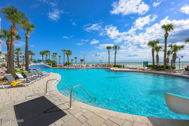 350 N Atlantic Ave Unit 2124, Daytona Beach, FL 32118 - view of swimming pool featuring a patio area and a water view