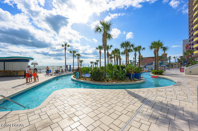 350 N Atlantic Ave Unit 2124, Daytona Beach, FL 32118 - view of pool with a patio area