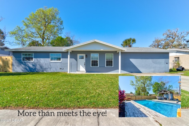 view of front of property featuring a fenced in pool, brick siding, a front lawn, and fence