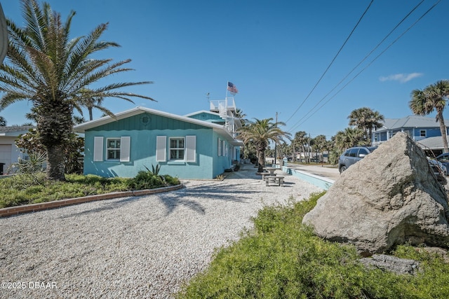 view of property exterior featuring a patio