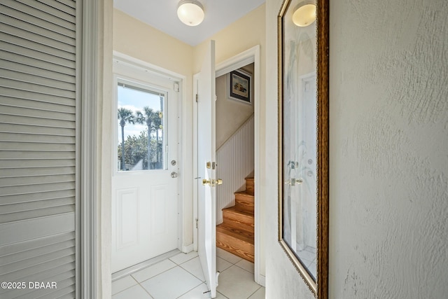 doorway to outside featuring light tile patterned floors