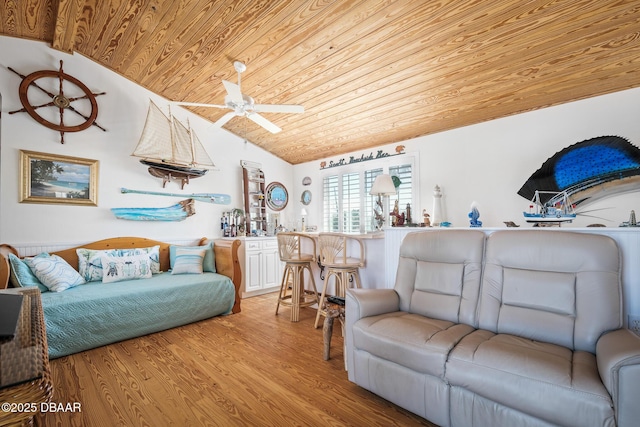 living room featuring wood ceiling, ceiling fan, vaulted ceiling, and light hardwood / wood-style floors