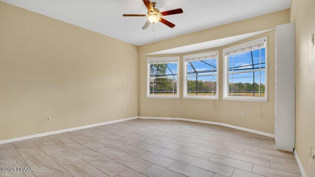 spare room with ceiling fan