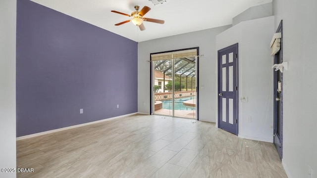 empty room with french doors and ceiling fan