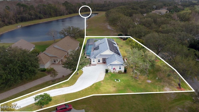 birds eye view of property with a water view