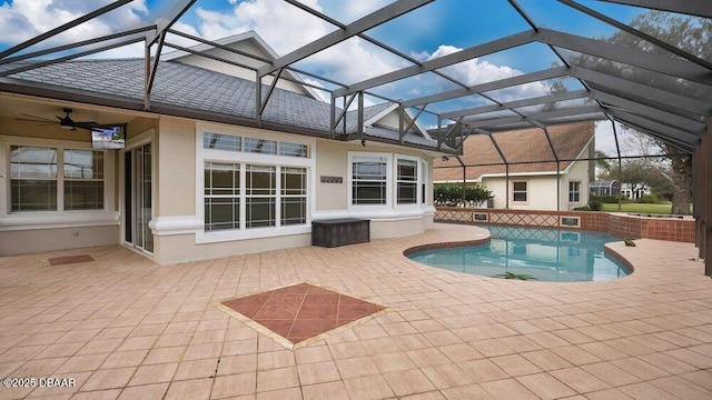 view of swimming pool featuring a patio area and a lanai