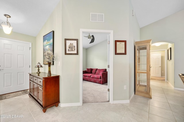 118 Bird Of Paradise Dr, Palm Coast, FL 32137 - entrance foyer featuring arched walkways, light tile patterned floors, and high vaulted ceiling