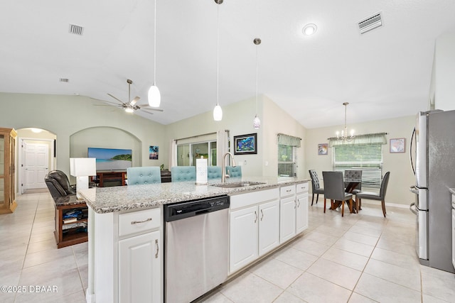 118 Bird Of Paradise Dr, Palm Coast, FL 32137 - kitchen featuring appliances with stainless steel finishes, lofted ceiling, light tile patterned floors, white cabinets, and ceiling fan