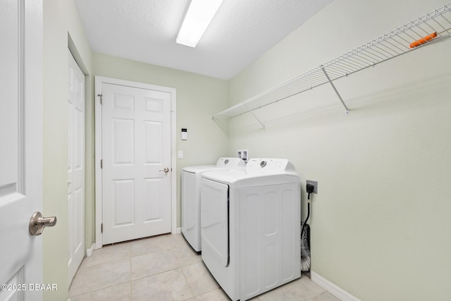 118 Bird Of Paradise Dr, Palm Coast, FL 32137 - laundry area featuring washing machine and dryer and light tile patterned flooring