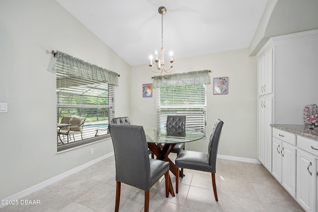 118 Bird Of Paradise Dr, Palm Coast, FL 32137 - dining space with vaulted ceiling, a chandelier, and light tile patterned floors