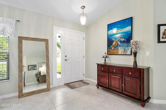 118 Bird Of Paradise Dr, Palm Coast, FL 32137 - foyer entrance with light tile patterned floors and baseboards