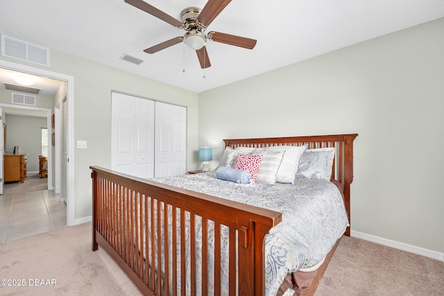 118 Bird Of Paradise Dr, Palm Coast, FL 32137 - bedroom with light carpet, a closet, and a ceiling fan