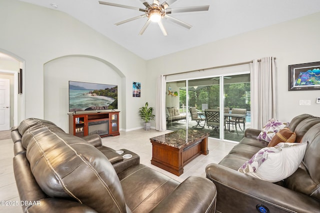 118 Bird Of Paradise Dr, Palm Coast, FL 32137 - living room with arched walkways, a ceiling fan, lofted ceiling, and light tile patterned floors