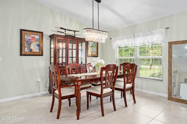 118 Bird Of Paradise Dr, Palm Coast, FL 32137 - dining area with a chandelier and light tile patterned floors