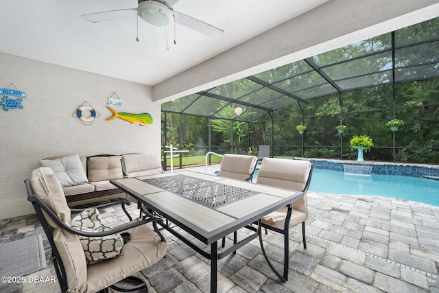 118 Bird Of Paradise Dr, Palm Coast, FL 32137 - outdoor pool featuring a patio area, a ceiling fan, outdoor dining space, and glass enclosure