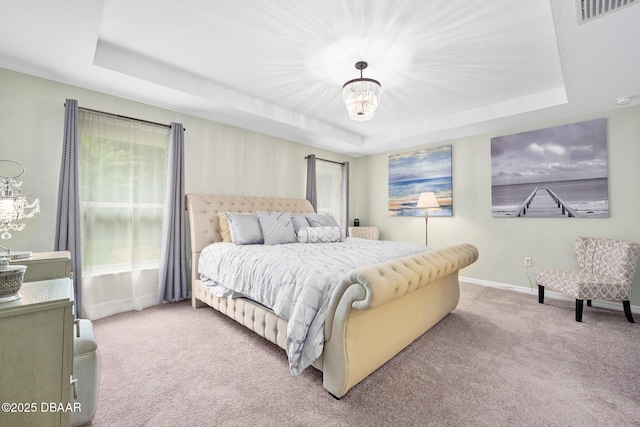 118 Bird Of Paradise Dr, Palm Coast, FL 32137 - bedroom featuring a raised ceiling, carpet floors, and a chandelier