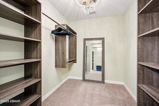 118 Bird Of Paradise Dr, Palm Coast, FL 32137 - spacious closet with carpet flooring and a chandelier