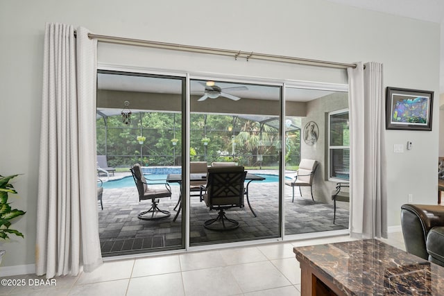 118 Bird Of Paradise Dr, Palm Coast, FL 32137 - dining room with a sunroom, a ceiling fan, and tile patterned flooring